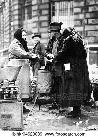 Humans warm themselves at wood stove approx. 1930, exact place unknown, Germany, Europe View Large Photo Image Stock Photo - Humans warm themselves at wood stove approx. 1930, exact place unknown, Germany, Europe. Fotosearch