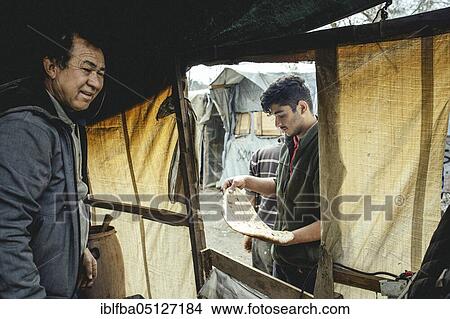 Improvised bakery, flat bread, Camp Moria, Lesbos, Greece, Europe View Large Photo Image Picture - Improvised bakery, flat bread, Camp Moria, Lesbos, Greece, Europe. Fotosearch