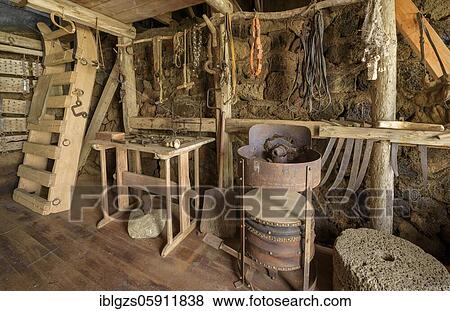 Interior view of a historical workshop with grindstone on a peat farm, turf house settlement Grenjadarstadur, Grenjaðarstaður, Þingeyjarsveit, Norðurland eystra, Iceland, Europe View Large Photo Image Stock Photo - Interior view of a historical workshop with grindstone on a peat farm, turf house settlement Grenjadarstadur, Grenjaðarstaður, Þingeyjarsveit, Norðurland eystra, Iceland, Europe. Fotosearch