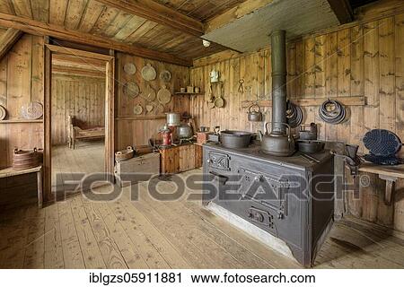 Interior view of historical kitchen with old oven, pans, pots, tea maker and waffle iron on peat yard, sod house settlement Grenjadarstadur, Grenjaðarstaður, Þingeyjarsveit, Norðurland eystra, Iceland, Europe View Large Photo Image Stock Image - Interior view of historical kitchen with old oven, pans, pots, tea maker and waffle iron on peat yard, sod house settlement Grenjadarstadur, Grenjaðarstaður, Þingeyjarsveit, Norðurland eystra, Iceland, Europe. Fotosearch