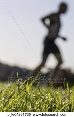 Jogger running in grass, dewdrops, Germany, Europe View Large Photo Image Stock Photography - Jogger running in grass, dewdrops, Germany, Europe. Fotosearch