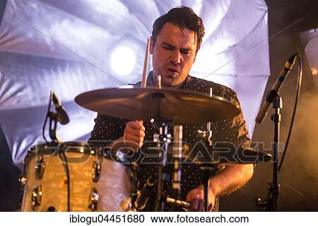 Jwan Steiner, drummer of the Swiss singer and songwriter Lukas Linder alias Henrik Belden with the band at the record baptism live in the Schüür Lucerne, Switzerland, Europe View Large Photo Image Stock Image - Jwan Steiner, drummer of the Swiss singer and songwriter Lukas Linder alias Henrik Belden with the band at the record baptism live in the Schüür Lucerne, Switzerland, Europe. Fotosearch