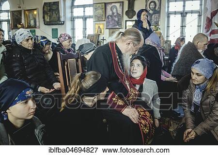 K, Ochamchira, Abkhazia, GeorgiaChurch of Father Sergei during an exorcism. He is widely known as an exorcist and receives people seeking help from all over Russia View Large Photo Image Stock Photo - K, Ochamchira, Abkhazia, GeorgiaChurch of Father Sergei during an exorcism. He is widely known as an exorcist and receives people seeking help from all over Russia. Fotosearch