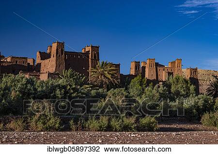 Stock Image - Kasbah Ait Benhaddou, largest Berber fortress, fortified Berber village, Ksar with clay castles, Kasbahs, Tighremt, South Morocco, Morocco, Africa. Fotosearch