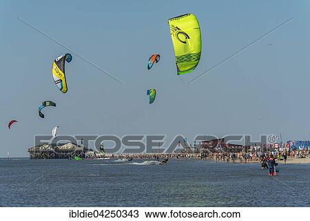 Stock Image - Kitesurfers, Pringle Kitesurf World Cup, Sankt Peter-Ording, North Sea, North Frisia, Schleswig-Holstein, Germany, Europe. Fotosearch