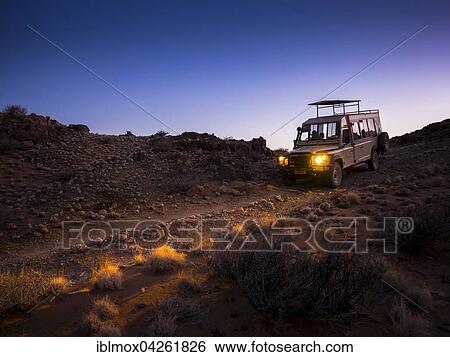 Land Rover driving in the Kulala Wilderness Reserve, Namib Desert at dawn, Tsaris Mountains, Hardap Region, Namibia, Africa View Large Photo Image Stock Photograph - Land Rover driving in the Kulala Wilderness Reserve, Namib Desert at dawn, Tsaris Mountains, Hardap Region, Namibia, Africa. Fotosearch