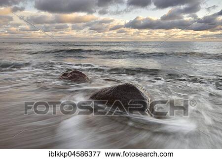 Large stones on the beach, surf at the Baltic Sea coast near Sassnitz, Rügen, Mecklenburg-Western Pomerania, Germany, Europe View Large Photo Image Stock Photo - Large stones on the beach, surf at the Baltic Sea coast near Sassnitz, Rügen, Mecklenburg-Western Pomerania, Germany, Europe. Fotosearch