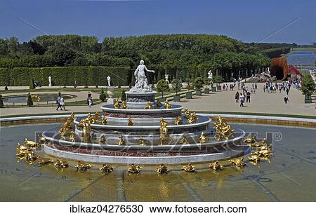 Stock Image - Latona fountain and metal horn of the artist Anish Kapoor in the castle gardens, Palace of Versailles, UNESCO World Heritage Site, Versailles, Yvelines, Region Ile-de-France, France, Europe. Fotosearch