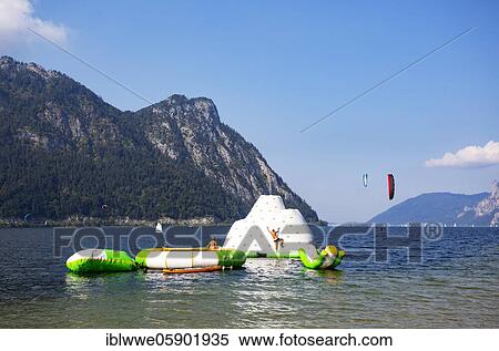 Stock Photography - Lido in Ebensee with kitesurfer and Sonnstein, Ebensee, Salzkammergut, Upper Austria, Austria, Europe. Fotosearch