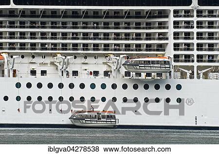 Lifeboats being lowered into the water, emergancy exercise on the cruise ship MSC Poesia, Geiranger, Norway, Europe View Large Photo Image Stock Photo - Lifeboats being lowered into the water, emergancy exercise on the cruise ship MSC Poesia, Geiranger, Norway, Europe. Fotosearch