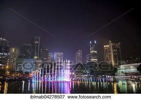 Light show, water fountain, Lake Symphony, city park, skyscrapers, City Centre, Kuala Lumpur, Malaysia, Asia View Large Photo Image Stock Photo - Light show, water fountain, Lake Symphony, city park, skyscrapers, City Centre, Kuala Lumpur, Malaysia, Asia. Fotosearch