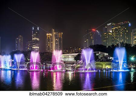 Stock Photo - Light show, water fountain, Lake Symphony, city park, skyscrapers, City Centre, Kuala Lumpur, Malaysia, Asia. Fotosearch