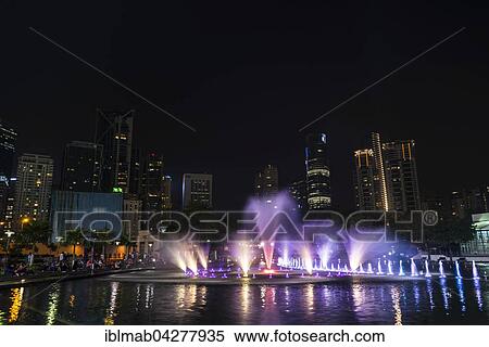 Stock Photography - Light show, water fountain, Lake Symphony, city park, skyscrapers, City Centre, Kuala Lumpur, Malaysia, Asia. Fotosearch