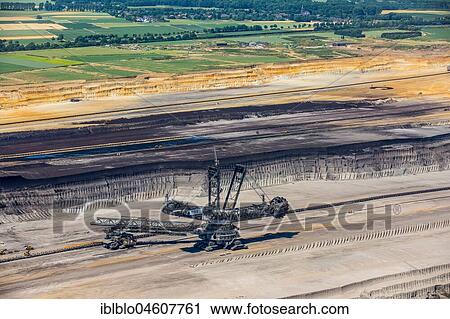 Lignite-coal excavator, open-cast lignite mine Garzweiler, RWE-Power, Rheinische Braunkohlerevier, Borschemich, Jüchen, Lower Rhine, Lignite-coal area, North Rhine-Westphalia, Germany, Europe View Large Photo Image Stock Image - Lignite-coal excavator, open-cast lignite mine Garzweiler, RWE-Power, Rheinische Braunkohlerevier, Borschemich, Jüchen, Lower Rhine, Lignite-coal area, North Rhine-Westphalia, Germany, Europe. Fotosearch