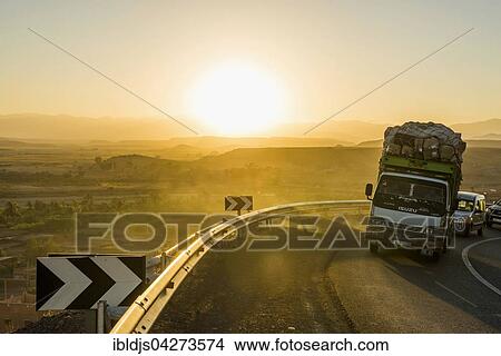 Loaded truck on curvy road in Dades Valley at sunset, Ouarzazate, Morocco, Africa View Large Photo Image Picture - Loaded truck on curvy road in Dades Valley at sunset, Ouarzazate, Morocco, Africa. Fotosearch