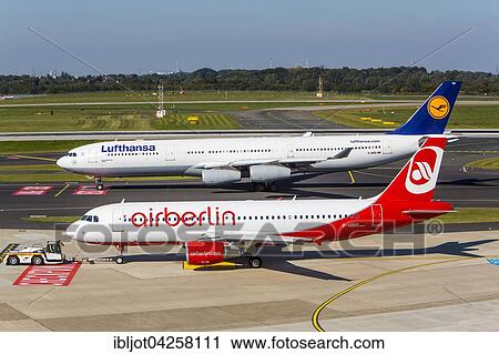 Stock Image - Lufthansa Airbus A340 and Air Berlin Airbus A320, Dusseldorf International airport, Dusseldorf, North Rhine-Westphalia, Germany, Europe. Fotosearch