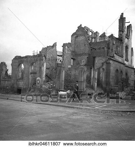 Stock Photo - Man and girl strolling with a goat along destroyed buildings in Freiburg, after 1945, Freiburg, Germany, Europe. Fotosearch
