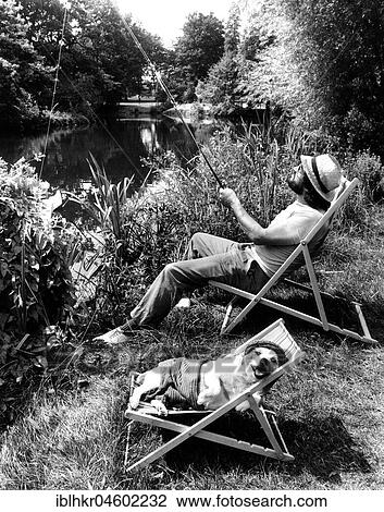 Man angling, dog in deck chair, England, Great Britain View Large Photo Image Stock Image - Man angling, dog in deck chair, England, Great Britain. Fotosearch