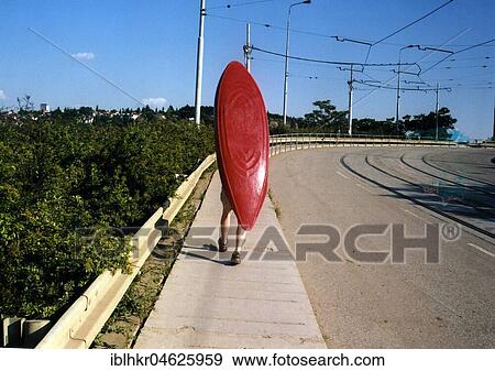 Stock Photo - Man carries canoe on his back about 1970s, exact place unknown, Czech Republic, Europe. Fotosearch