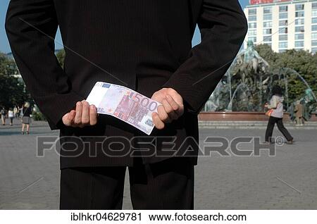 Man hides a 500 euro note behind his back, Berlin, Germany, Europe View Large Photo Image Stock Image - Man hides a 500 euro note behind his back, Berlin, Germany, Europe. Fotosearch
