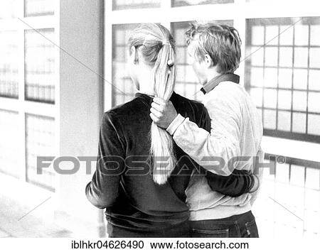 Stock Image - Man holds woman by her hair, ca. 1980s, East Berlin, GDR, Germany, Europe. Fotosearch