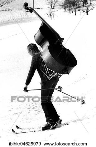 Man is skiing with bass ca. 1970s, exact place unknown, Czech Republic, Europe View Large Photo Image Stock Photo - Man is skiing with bass ca. 1970s, exact place unknown, Czech Republic, Europe. Fotosearch