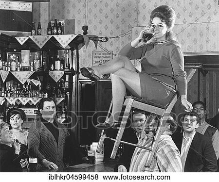 Man lifts woman on your chair only with his teeth, England, Great Britain View Large Photo Image Stock Photo - Man lifts woman on your chair only with his teeth, England, Great Britain. Fotosearch