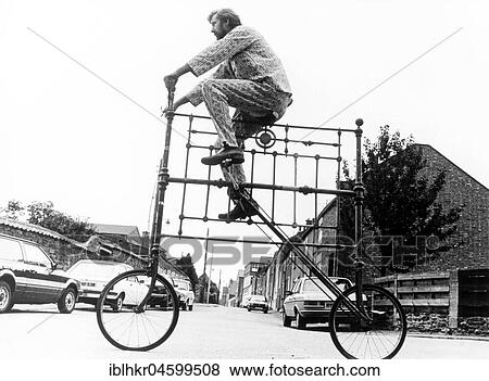Man on curious big bike, England, Great Britain View Large Photo Image Stock Photo - Man on curious big bike, England, Great Britain. Fotosearch
