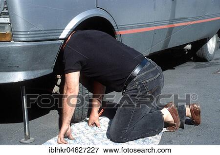 Stock Photo - Man repairs car, Berlin, Germany, Europe. Fotosearch