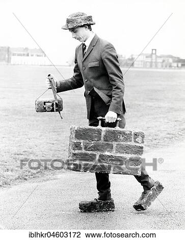 Man with suitcase, shoes and camera made of bricks, England, Great Britain View Large Photo Image Stock Image - Man with suitcase, shoes and camera made of bricks, England, Great Britain. Fotosearch