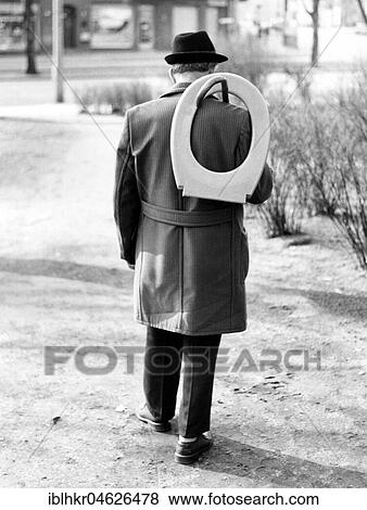 Man with toilet seat, ca. 1980s, East Berlin, GDR, Germany, Europe View Large Photo Image Stock Photo - Man with toilet seat, ca. 1980s, East Berlin, GDR, Germany, Europe. Fotosearch