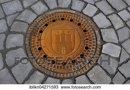 Stock Image - Manhole cover, Free and Hanseatic City of Hamburg, Germany, Europe. Fotosearch