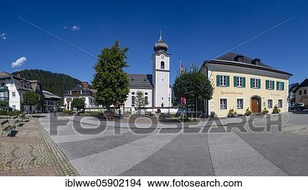 Picture - Market place with parish church Sankt Sigismund, Strobl am Wolfgangsee, Salzkammergut, province of Salzburg, Austria, Europe. Fotosearch