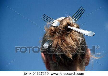 Stock Photo - Meal, forks in a woman's hair, Berlin, Germany, Europe. Fotosearch