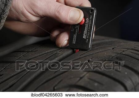 Measuring a car tire's tread depth, summer tires, winter tires, Germany, Europe View Large Photo Image Stock Image - Measuring a car tire's tread depth, summer tires, winter tires, Germany, Europe. Fotosearch