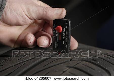 Measuring a car tire's tread depth, summer tires, winter tires, Germany, Europe View Large Photo Image Stock Photo - Measuring a car tire's tread depth, summer tires, winter tires, Germany, Europe. Fotosearch