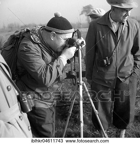 Men photographing with tripod around 1950, Surroundings of Freiburg, Germany, Europe View Large Photo Image Stock Image - Men photographing with tripod around 1950, Surroundings of Freiburg, Germany, Europe. Fotosearch