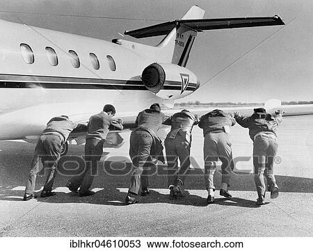Men pushing an airplane, Mexico City, Mexico, Central America View Large Photo Image Stock Image - Men pushing an airplane, Mexico City, Mexico, Central America. Fotosearch