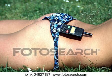 Mobile phone in bikini pants, Berlin, Germany, Europe View Large Photo Image Stock Photo - Mobile phone in bikini pants, Berlin, Germany, Europe. Fotosearch