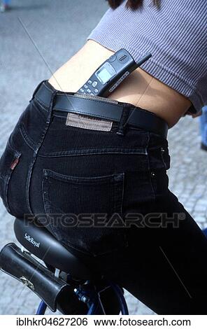 Mobile phone in trousers while cycling, Berlin, Germany, Europe View Large Photo Image Stock Photograph - Mobile phone in trousers while cycling, Berlin, Germany, Europe. Fotosearch