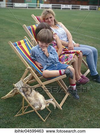 Mother with children and little lion in a deckchair, England, Great Britain View Large Photo Image Stock Image - Mother with children and little lion in a deckchair, England, Great Britain. Fotosearch