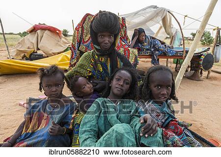Mother with children, Gerewol festival, courtship ritual competition among the Woodaabe Fula people, Niger, Africa View Large Photo Image Stock Image - Mother with children, Gerewol festival, courtship ritual competition among the Woodaabe Fula people, Niger, Africa. Fotosearch