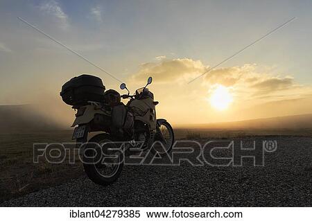Stock Photography - Motorcycle parked on the street, midnight sun, North Cape, Mageroya, Finnmark County, Norway, Europe. Fotosearch