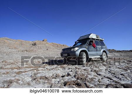 Off-road vehicle on the road in the valley of the moon, Valle de la Luna, San Pedro de Atacama, Antofagasta, Chile, South America View Large Photo Image Stock Photo - Off-road vehicle on the road in the valley of the moon, Valle de la Luna, San Pedro de Atacama, Antofagasta, Chile, South America. Fotosearch