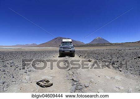Off-road vehicle on the way on the lagoon route in the Altiplano, Reserva Nacional de Fauna Andina Eduardo Abaroa, Sur Lípez, Potosí, Bolivia, South America View Large Photo Image Picture - Off-road vehicle on the way on the lagoon route in the Altiplano, Reserva Nacional de Fauna Andina Eduardo Abaroa, Sur Lípez, Potosí, Bolivia, South America. Fotosearch