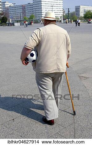 Old man with soccer, Berlin, Germany, Europe View Large Photo Image Picture - Old man with soccer, Berlin, Germany, Europe. Fotosearch