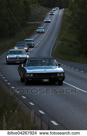 Oldtimers driving to the yearly oldtimer meeting, from Arvika to Hillringsberg, 1970 Chevrolet Impala at the front, altered license plate, Varmland, Sweden, Europe View Large Photo Image Picture - Oldtimers driving to the yearly oldtimer meeting, from Arvika to Hillringsberg, 1970 Chevrolet Impala at the front, altered license plate, Varmland, Sweden, Europe. Fotosearch