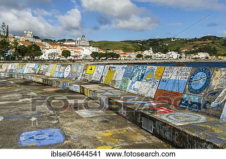 Stock Image - Painted port wall with graffiti, Horta, Island of Faial, Azores, Portugal, Europe. Fotosearch