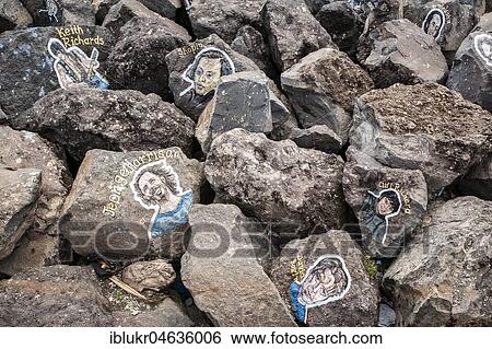 Stock Photograph - Painted portraits of famous musicians on stones, Auditorio de Tenerife, Santa Cruz de Tenerife, Tenerife, Spain, Europe. Fotosearch