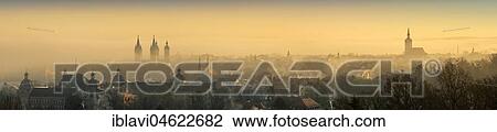 Stock Image - Panorama of the city with early morning mist at sunrise, on the left the cathedral, on the right the Wenceslas Church, Naumburg, Saxony-Anhalt, Germany, Europe. Fotosearch